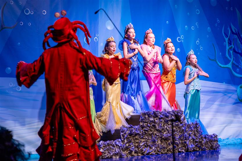 Students perform onstage